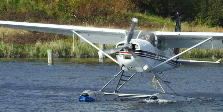 Ken Cote flying a C-GDIR, which is a Cessna A185F.