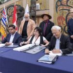 Member of the Kitselas First Nations joined by representatives of the BC government to initial a new treaty.