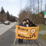 Kimberly (left) and Jordan Joseph on Highway 99, Sḵwx̱wú7mesh (Squamish). The couple planned a walk from “Prince Rupert” to “Victoria” raising awareness for indigenous children in foster care
